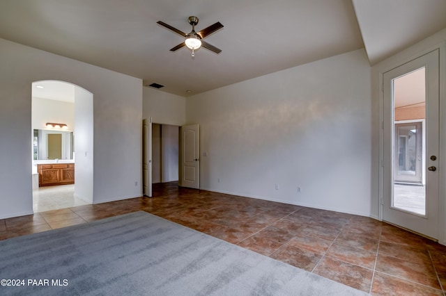 unfurnished room featuring ceiling fan and light tile patterned flooring