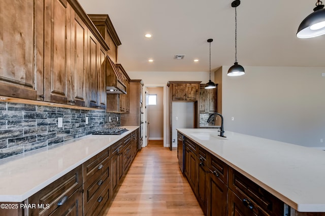 14320 E Casa Serena Way, Prescott Valley, AZ 86315 - kitchen featuring a sink, backsplash, light wood finished floors, exhaust hood, and recessed lighting