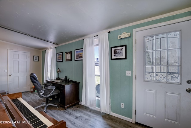 foyer entrance featuring hardwood / wood-style floors and vaulted ceiling