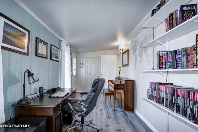 office space with light hardwood / wood-style floors and lofted ceiling