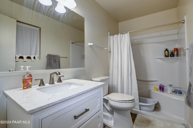 full bathroom with vanity, toilet, and shower / bath combo with shower curtain