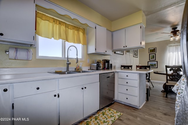 kitchen featuring ceiling fan, sink, stainless steel dishwasher, white cabinets, and light wood-type flooring