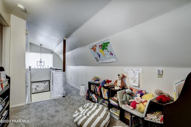 interior space with carpet flooring and vaulted ceiling