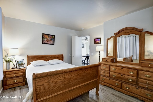 bedroom with hardwood / wood-style floors