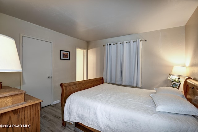 bedroom with wood-type flooring