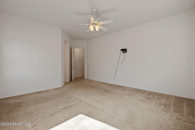 carpeted empty room with ceiling fan