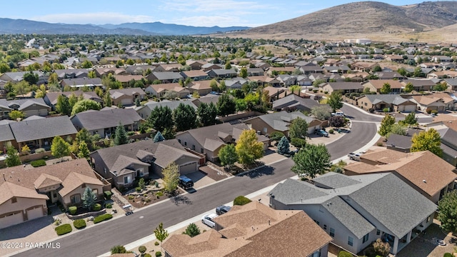 birds eye view of property featuring a mountain view