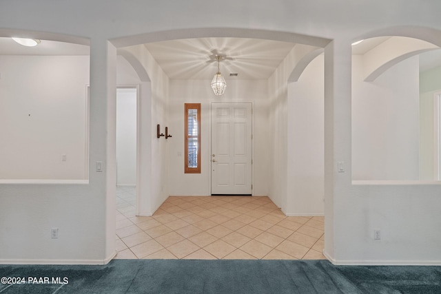 entryway with light tile patterned floors