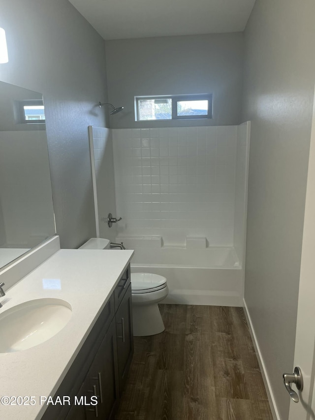 9901 E Arrowhead Dr Unit 20, Prescott Valley, AZ 86314 - bathroom with toilet, vanity, wood finished floors, bathtub / shower combination, and baseboards