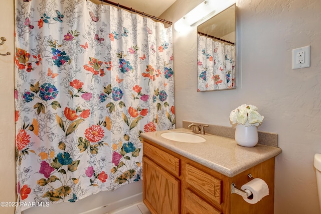 bathroom with vanity and tile patterned flooring