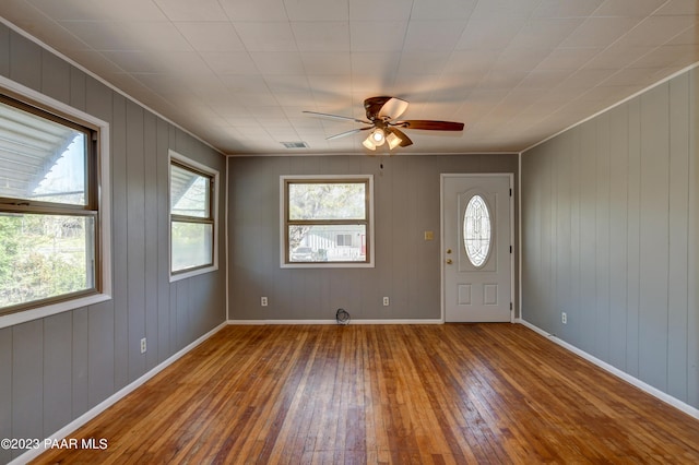 foyer entrance with hardwood / wood-style floors and ceiling fan