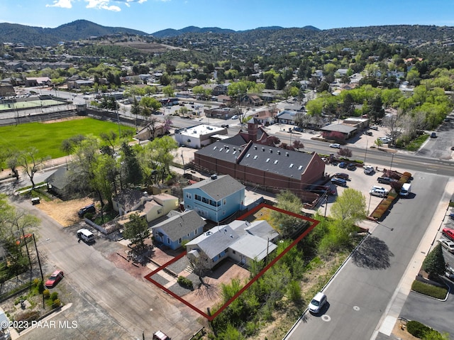 birds eye view of property featuring a mountain view