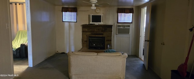12995 E Main St, Dewey-Humboldt, AZ 86329 - living room with a ceiling fan, carpet floors, a stone fireplace, and cooling unit