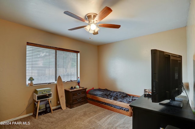 bedroom with ceiling fan and carpet floors