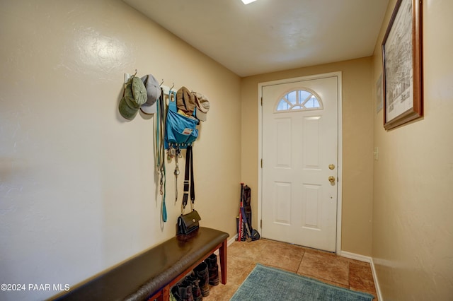 doorway to outside featuring light tile patterned floors