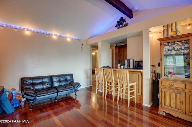 living room featuring lofted ceiling with beams and dark hardwood / wood-style floors