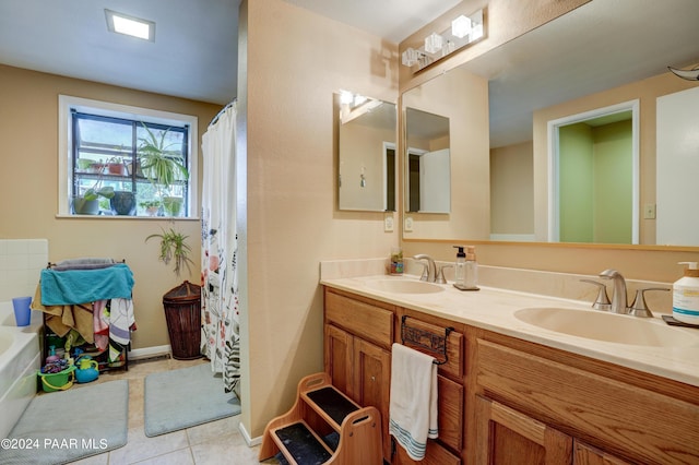 bathroom featuring vanity, a tub to relax in, and tile patterned floors