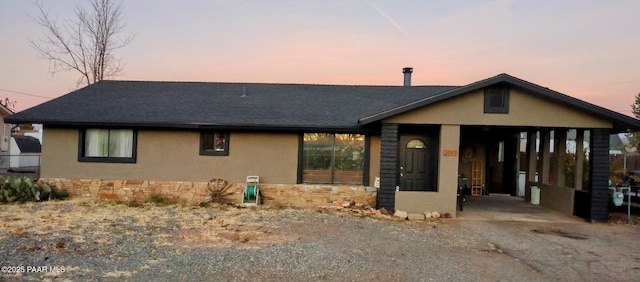 view of front facade with a carport