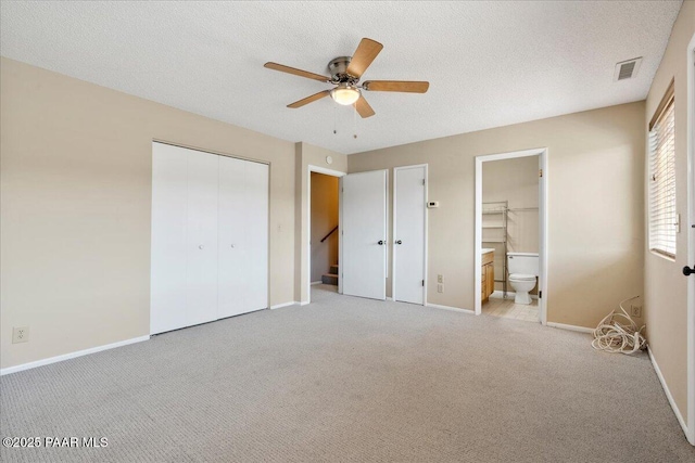 416 Hillcrest Dr, Prescott, AZ 86303 - unfurnished bedroom featuring carpet, baseboards, a closet, a textured ceiling, and ensuite bath