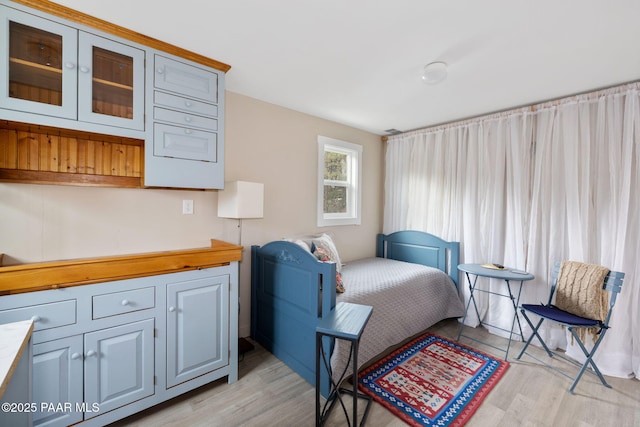 bedroom with light hardwood / wood-style flooring