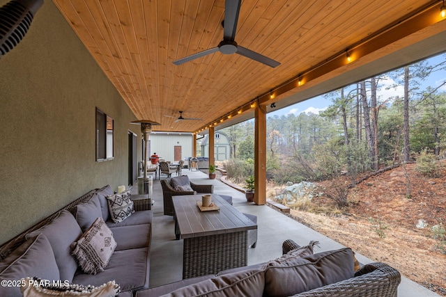 1700 S Sheriffs Posse Trl, Prescott, AZ 86303 - view of patio featuring visible vents, ceiling fan, an outdoor hangout area, an outdoor structure, and a storage unit