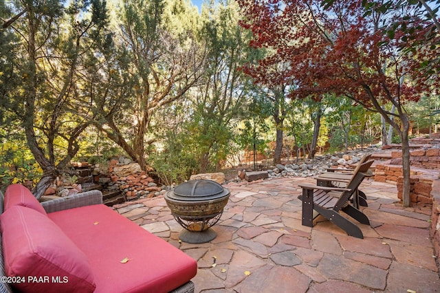 view of patio / terrace featuring a fire pit