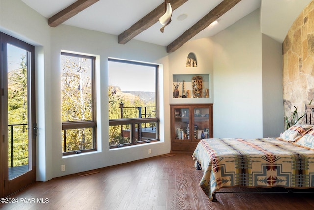 bedroom featuring beam ceiling, access to exterior, and wood-type flooring