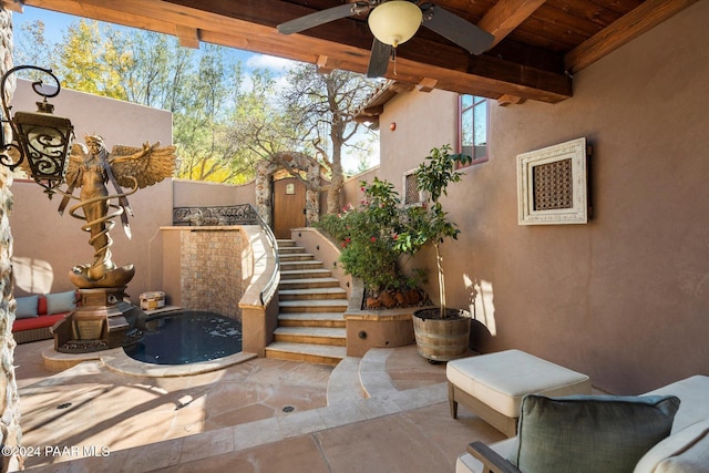 view of patio with ceiling fan