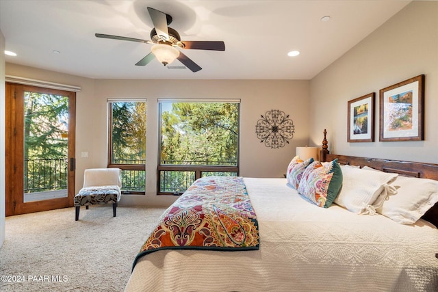 bedroom with access to exterior, ceiling fan, and carpet floors