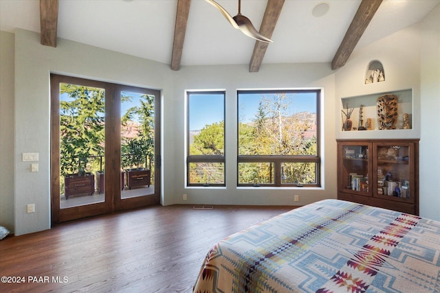 bedroom featuring beamed ceiling, dark wood-type flooring, and access to outside