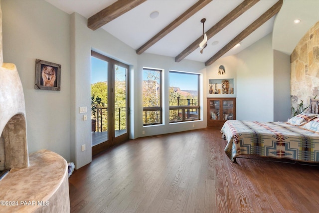 bedroom with beamed ceiling, access to exterior, multiple windows, and french doors