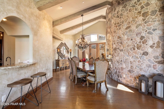 dining area with high vaulted ceiling, sink, dark hardwood / wood-style floors, beam ceiling, and a chandelier