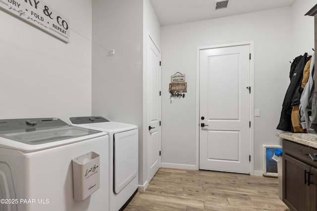10210 E Dawn To Milky Way, Prescott Valley, AZ 86315 - laundry area featuring washing machine and dryer, light wood-style floors, cabinet space, and baseboards