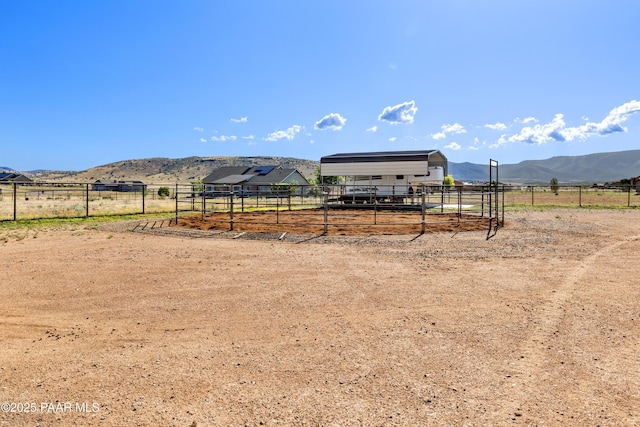 10210 E Dawn To Milky Way, Prescott Valley, AZ 86315 - view of yard with a detached carport, an exterior structure, an outbuilding, a view of rural / pastoral area, and a mountain view