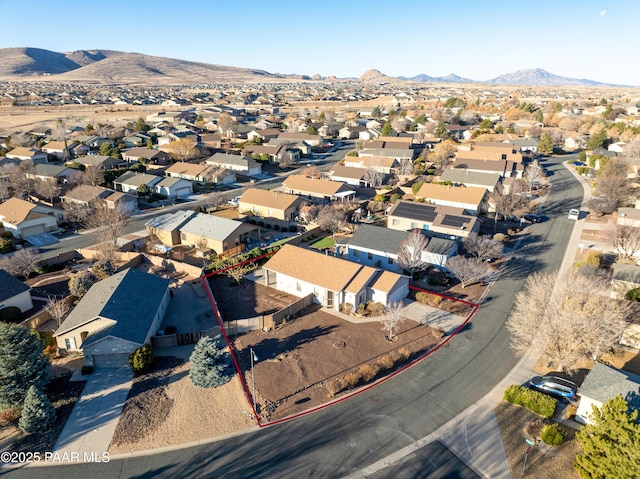 birds eye view of property with a mountain view