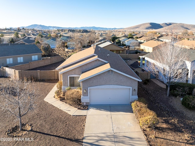 birds eye view of property featuring a mountain view