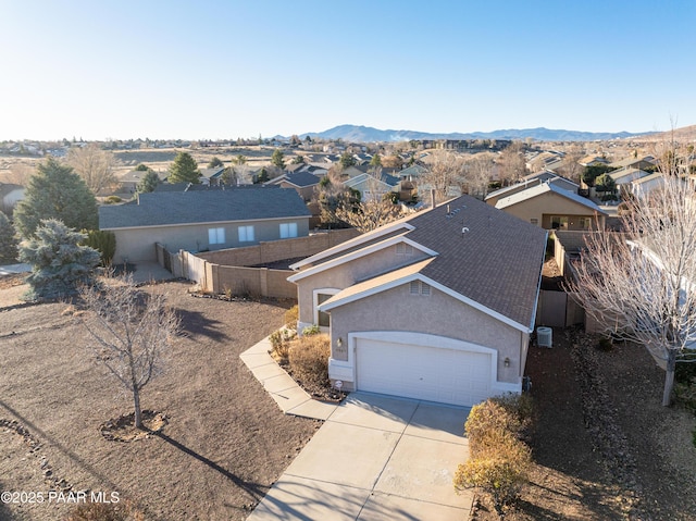 birds eye view of property featuring a mountain view