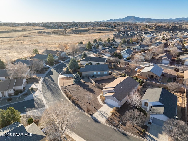 birds eye view of property featuring a mountain view