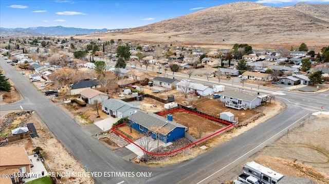 drone / aerial view with a residential view and a mountain view