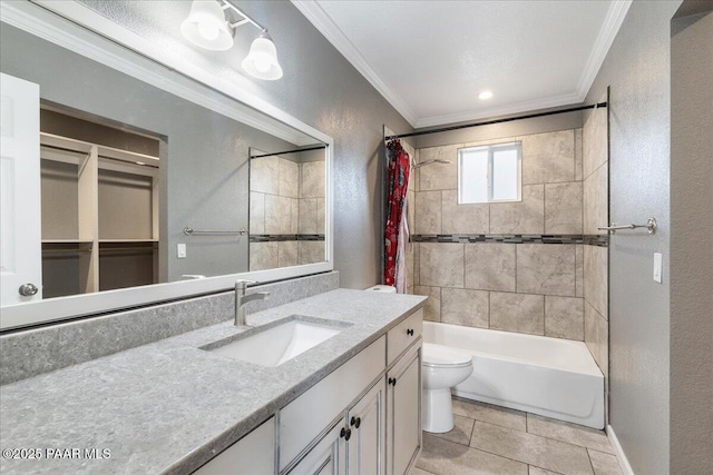 bathroom with toilet, ornamental molding, vanity, and a textured wall