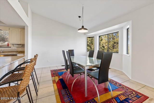 dining area with light tile patterned floors