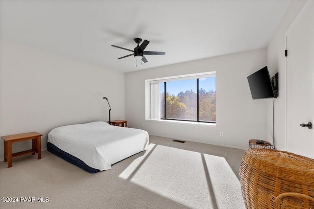 bedroom featuring ceiling fan and carpet floors