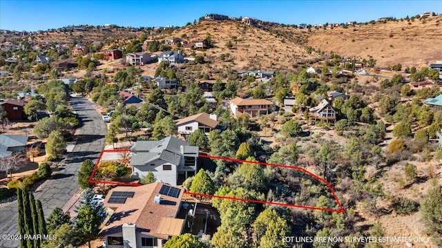 birds eye view of property with a mountain view