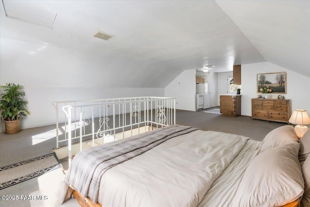 bedroom featuring vaulted ceiling and carpet flooring