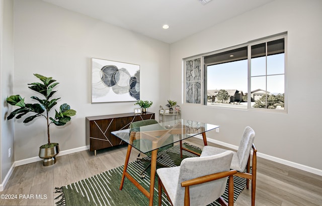dining area featuring baseboards, recessed lighting, and light wood-style floors