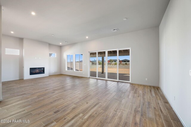 unfurnished living room featuring light hardwood / wood-style floors