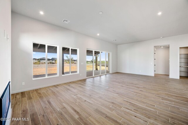 unfurnished living room with light hardwood / wood-style flooring