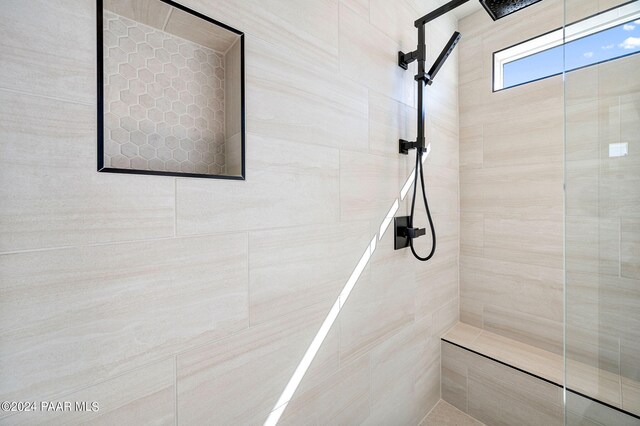 bathroom with tiled shower