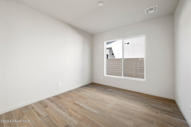 empty room with light wood-type flooring