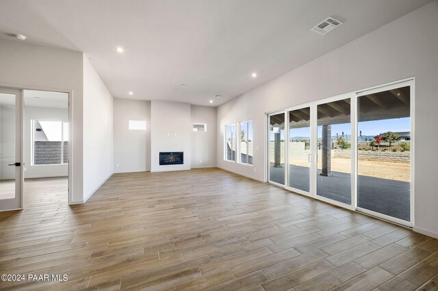 unfurnished living room featuring light hardwood / wood-style flooring